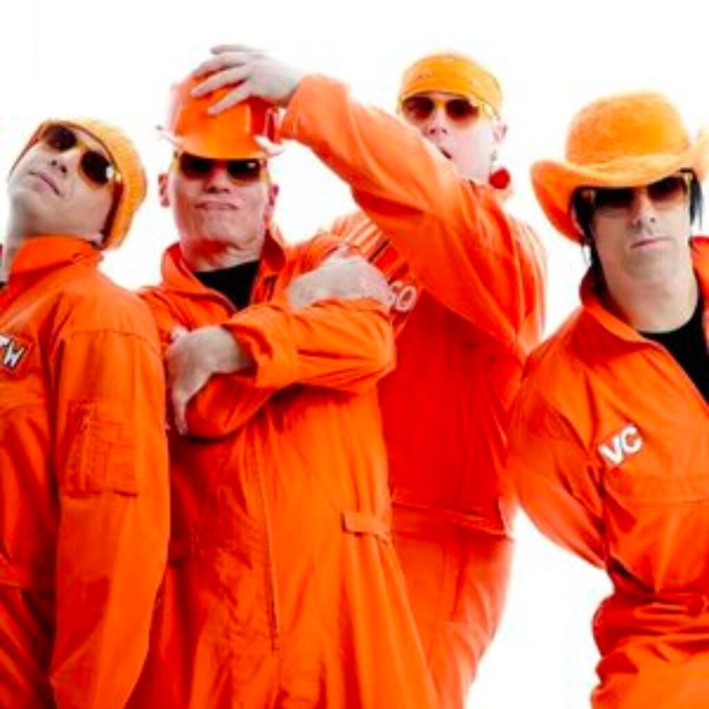 4 men dressed in orange jumpsuits